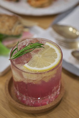 butterfly pea Mocktail with green mint and lime on wood table