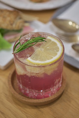 butterfly pea Mocktail with green mint and lime on wood table