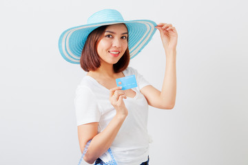 Woman in hat hand holding card