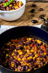 Chili corn carne on wood table