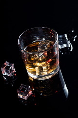Whisky, whiskey or bourbon with ice