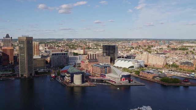 Baltimore Maryland Aerial v15 Panning around inner harbor cityscape with promenade and culture - October 2017