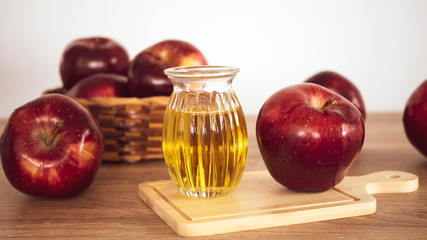 Close up red Apple fruit  and apple cider vinegar juice , Helps Lose Weight and Reduces Belly Fat , healthy food