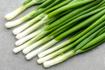 Fresh spring onion bunch, clean vegetables, organic freshly harvested garden produce. Fresh farm onions with green chive.