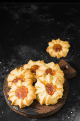 Cookies with apricot jam on a dark background