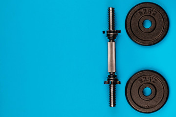 Lifting weights on blue background