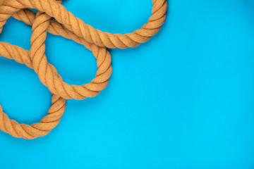 A gym battle rope on blue background