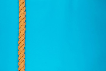 A gym battle rope on blue background