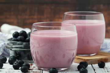 Two glasses with blueberry yogurt	