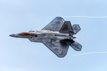 Advanced Tactical Fighter Jet Against Blue Skies - obrazy, fototapety, plakaty