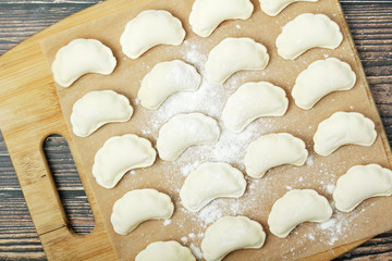 The process of cooking traditional vareniki - textured background