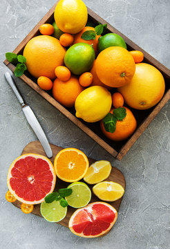 box with citrus fresh fruits on a concrete background © Olena Rudo