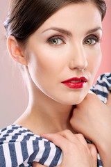 Close up face beauty portrait of young woman with natural clean skin.