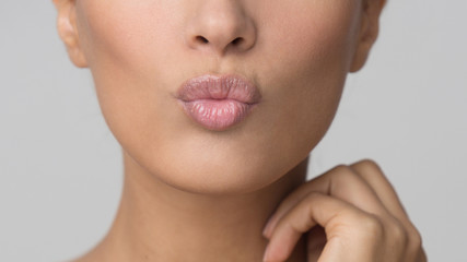 Beauty Concept. Girl Sending Kiss With Pout Lips