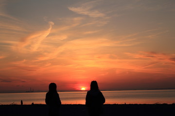 silhouette of man on the beach at sunset