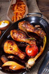 grilled chicken legs in barbecue marinade with sweet potatoes
