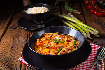 colorful turkey fricassee with asparagus and paprika