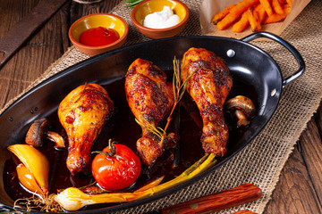 grilled chicken legs in barbecue marinade with sweet potatoes