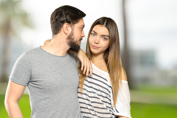 Fototapeta premium Happy couple embracing and looking at camera