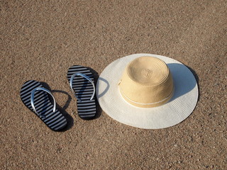Fototapeta na wymiar Summer beach accessories on sand