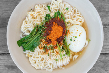 Top view Thai noodles with flavouring powder and vegetable.