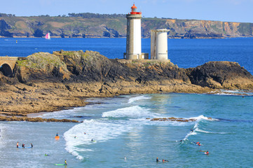 Surfing near the lighthouse of  