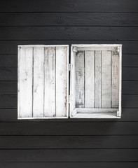 old white empty wooden box isolated on black wooden background