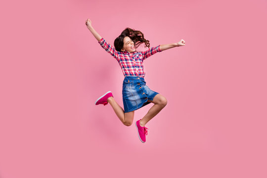 Full length body size view photo delighted funny lady people young person raise hands fists scream yeah achievement content isolated wear fashionable plaid denim jeans skirt outfit pastel background