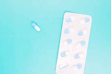 white capsules close up, pills capsules with white powder inside close up, coated medicine, medical...