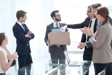 business team congratulating a new employee with a raise