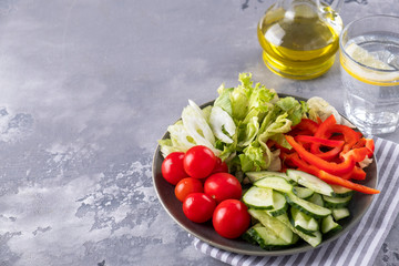 Assorted of fresh vegetables on a plate. Diet food. Healthy concept. Copy space