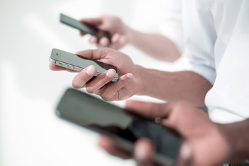 close up. smartphones in the hands of the business team