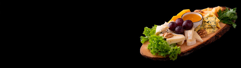 Different types of cheese  isolated on a black. Copy space