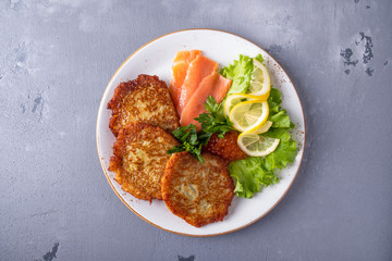 Tasty potato pancakes with caviar and salmon. Top view.