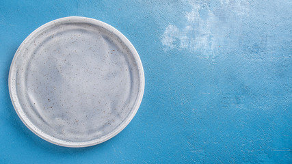 Emty round plate. Top view. Space for text