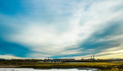 Blue sky with large cirrus clouds. Autumn day in Russia.