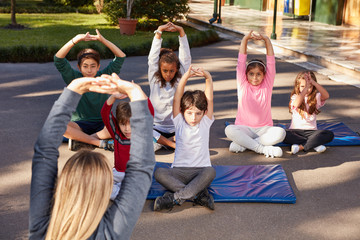 Group of students and teachers stretching