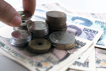 Japanese yen notes and Japanese yen coins for money concept background
