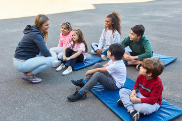 Physical education teacher and a group of students