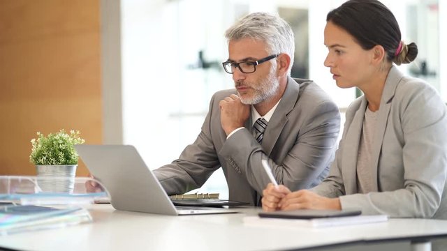 Corporate business colleagues working together in modern office - Powered by Adobe