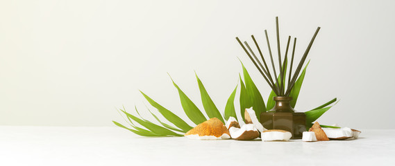 Aroma reed diffuser bottle home fragrance with rattan sticks with the scent of coconut and the...