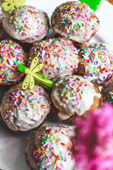 Cupcakes with multi-colored sprinkles close-up. Easter Day celebration. Holiday dinner