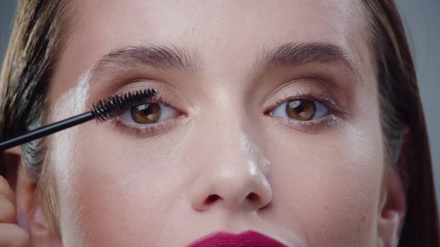 Beautiful eyes young woman applying mascara on eyelashes smile lashes application applying bathroom beautiful beauty black brush care cosmetic makeup eyelashes portrait slow motion