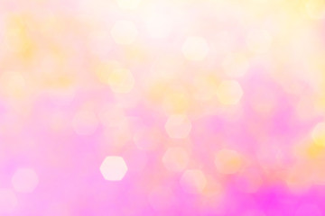 Blurred background - pink surface with gold sparkles. Abstract image. Bright color. Abstract circular bokeh.