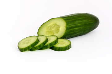 Cucumber and slices isolated over white background.
