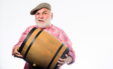 oktoberfest festival. brewery for maturing alcohol. Homemade wine. Man bearded senior carry wooden barrel for wine. Fermentation product. Retro man with a beer barrel. Barman. wooden barrel