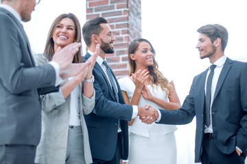 Fototapeta premium happy business team applauds new business partners