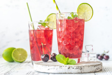 Two glasses of cherry mojito