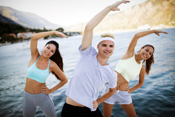 Friends fitness training together outdoors living active healthy