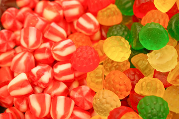 delicious multi-colored fruit marmalade. unhealthy bright candies in bulk. different jelly photo close. tasty sweets in the candy shop. nobody. 